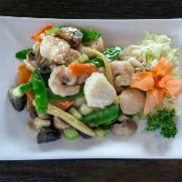 Double Happiness · Select scallops and shrimp sauteed with mushrooms, celery, carrots and snow peas in a Chines...