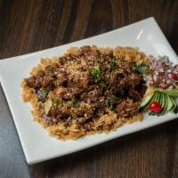 Pao Hu (Hot Burned Pork) · Hot burned sliced pork braised with crushed peanuts in a savory sauce. Served with steamed w...