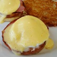 Eggs Benedict · Poached eggs, Canadian bacon on top of an English muffin topped with our homemade hollandais...