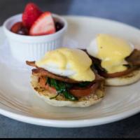Egg Florentine · Poached eggs, spinach, bacon and tomatoes on top of an English muffin, topped with hollandai...