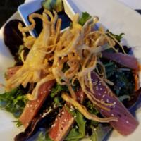 Crunchy Ahi Salad · Seared ahi, over organic mixed greens, carrots, celery and wonton bits, tossed in a toasted ...