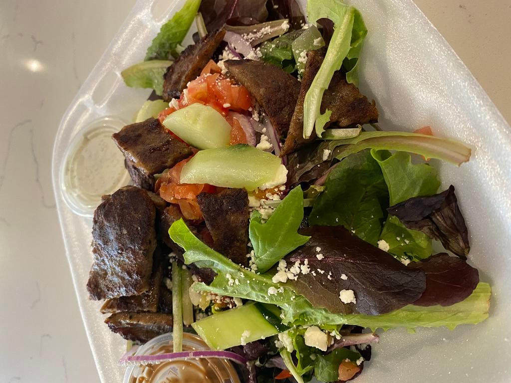 Gyro Salad Lunch · Lamb gyro, mixed greens, Kalamata olives, tomatoes, cucumbers, feta cheese, red onions and a balsamic vinaigrette, topped with tzatziki.