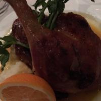 Half Roasted Duck in Orange Sauce · Served with garlic roasted mashed potatoes.