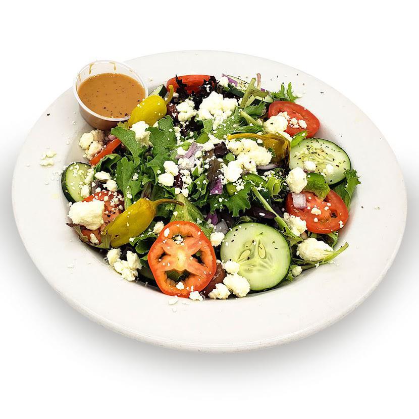 Greek Salad · Mixed greens, tomatoes, cucumbers, Bermuda onions, green peppers, Kalamata olives, pepperoncini, feta cheese, Greek and feta dressing.