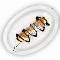 Cannoli · Crispy pastry shell, ricotta chocolate chip filling, confectionary sugar.