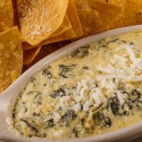 Spinach and Artichoke Dip · Served with homemade fried tortillas.