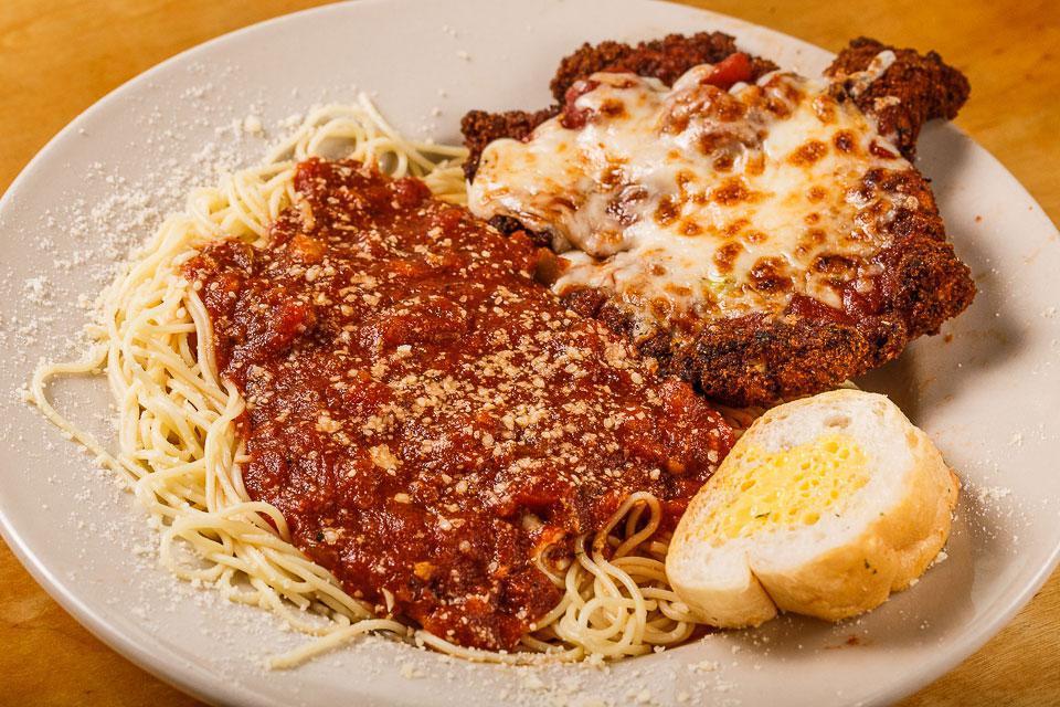 Chicken Parmesan · Paneed and topped with Italian cheese and red gravy. Served over angel hair with a side salad and your choice of dressing.