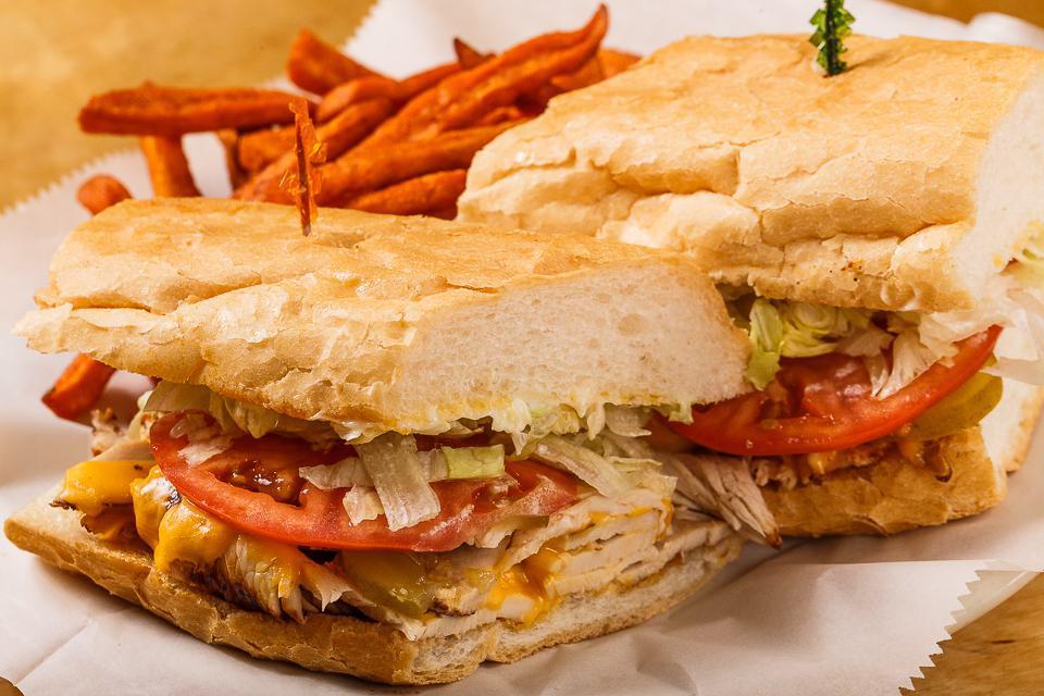 Turkey Melt Po Boy · Turkey and American cheese. Dressed with mayo, lettuce, tomatoes, and pickles on your choice of bread. Served with choice of side.