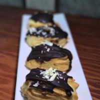 Eclair · Served with Bavarian cream and chocolate icing.