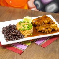 Pork Baby back Ribs · overnight marinade makes these ribs succulent
barbecue sauce
served with rice & beans