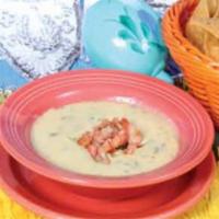 Queso Dip · Dip into a warm blend of selected cheeses, spinach and chiles, all baked together.