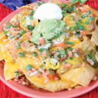 Nachos Fiesta · Crisp corn tortilla chips topped with beans, jalapenos and melted cheddar cheese. Garnished ...
