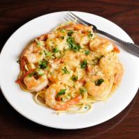 Shrimp Scampi · Garlic white wine sauce and served with spaghetti, house salad, and garlic bread.