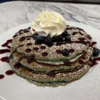 FULL STACK BLUE BATTER · Three blueberry batter pancakes, fresh blueberries, blueberry glaze, powdered sugar, whipped...