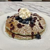 SHORT STACK BLUE BATTER · Two blueberry batter pancakes, fresh blueberries, blueberry glaze, powdered sugar, whipped c...