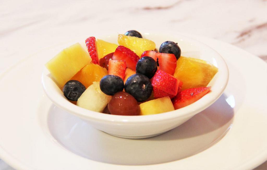 FRESH FRUIT · Seasonal berries and melons cut daily.