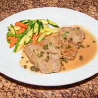 Veal Piccata · Veal scallopini dredged in flour and sauteed in lemon juice, butter and capers. 