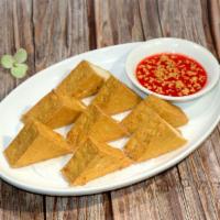 7. Deep Fried Tofu · 8 pieces of deep-fried tofu served with sweet and sour sauce and mixed with ground peanuts.