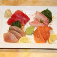 S4. Sashimi · 12 pieces of chef's choice sashimi. Served with miso soup.