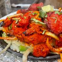 Tandoori Mixed Grill Specialty(halal) · A delicious combination of chicken, lamb, seekh kabab, and shrimp.
