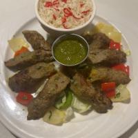 Boti (lamb) kebab  · Ground meat with ginger, garlic, onion, seasonings & herbs, roasted to perfection in our cla...