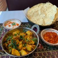 Aloo Gobhi · Cauliflower and potatoes cooked with herbs and spices.
