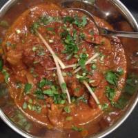 4. Lamb Bhuna Special(halal) · Cubes of lamb cooked with fresh-cut tomatoes, bell pepper, and onions.
