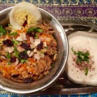 Chicken Biryani Specialty · Classic Mughlai dish of curried chicken in rice.

