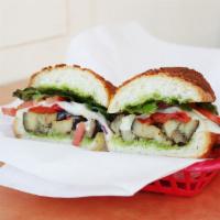 The Noe Vegetarian Sub · Roasted eggplant, roasted red peppers, red onions, provolone, pesto, spring mix, and tomato.