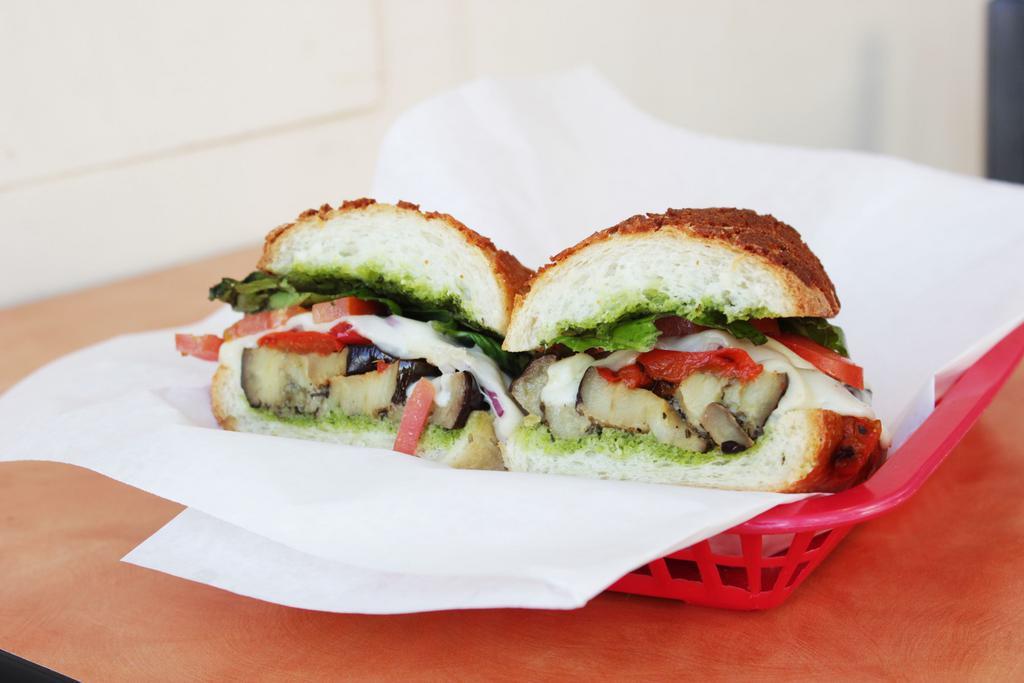 The Noe Vegetarian Sub · Roasted eggplant, roasted red peppers, red onions, provolone, pesto, spring mix, and tomato.