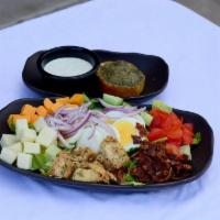 Cobb Salad · Grilled chicken breast, bacon, hard-boiled egg, cheddar, mozzarella, blue cheese, romaine, t...