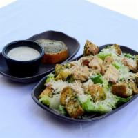 Chicken Caesar Salad · Grilled chicken breast, Parmesan cheese, romaine, crouton, garlic bread, Caesar dressing (on...
