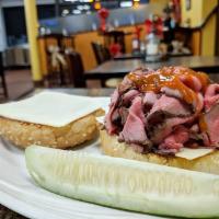 Roast Beef Sandwich · Served with half-sour pickle and choice of bread.