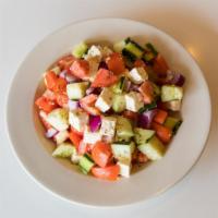 Village Salad · Ripe plum tomato, cucumber, red onion, oregano, feta cheese, tossed with imported extra virg...