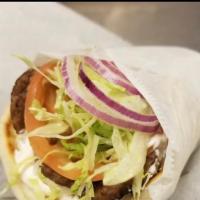 Gyro on Fresh Pita Bread Sandwich · Lamb or chicken smothered in tzatziki sauce with lettuce, tomato and onion.