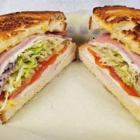 Monte Cristo Panini · Ham and turkey with American cheese, honey mustard, lettuce, tomato and onion. Mayo on the s...