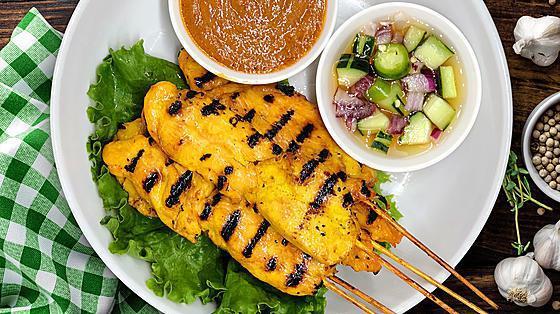 5 Pieces Chicken Satay · Grilled chicken marinated with coconut milk and Thai spices served with cucumber salad and homemade peanut sauce.