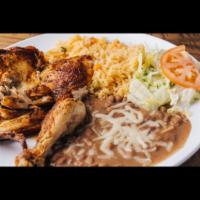 Medio Pollo · 1/2 chicken served with rice and beans lettuce guacamole.