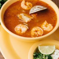 Caldo de Siete Mares · Seven seas soup includes clam, catfish, shrimp, and squid.