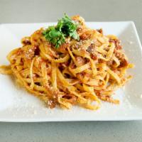 Tagliatelle Alla Bolognese · Typical Emilia Romagna pasta, served with a combination of ground beef in a homemade marinar...