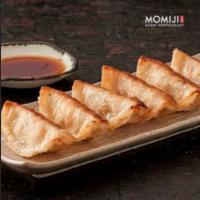 Gyoza · 8 piece Japanese dumplings filled with chicken and vegetables served either fried or steamed...