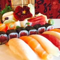 Sushi and Sashimi Deluxe · 5 pieces sushi chef’s choice, 8 pieces sashimi chef’s choice.plus 1 tuna roll and eel cucumb...
