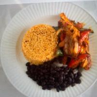 Fish fajitas  · Fish  peppers onions tomato served w rice  & black beans & corn  tortillas 