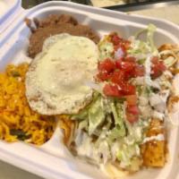 Enchiladas · 3 cheese filled corn tortillas, salsa roja, crema, cotija cheese, yellow rice, pinto beans, ...