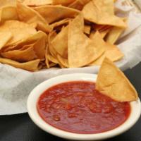 Homemade Tortilla Chips · Served with salsa. Add queso for an extra charge.