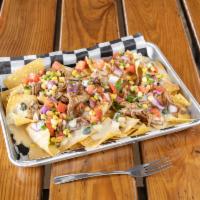 Pulled Pork Nachos · House chips topped with signature white queso, pulled pork, and pico de gallo.