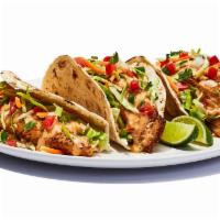 Baja Fish Tacos · Like a Mexican vacation, in taco form. Get ’em grilled or fried crispy. Served on warm torti...