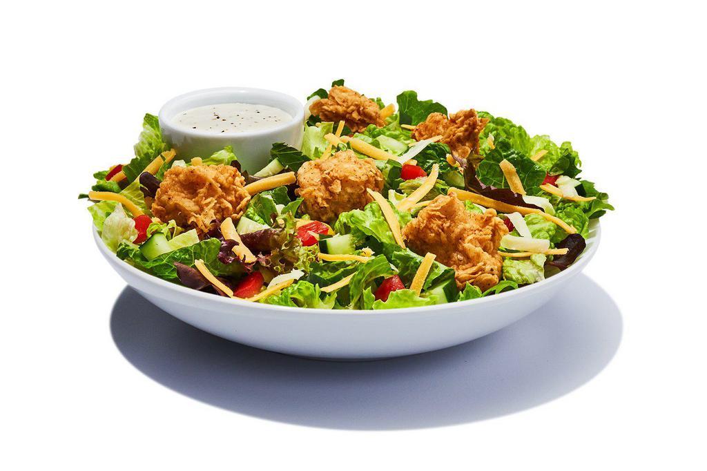 Chicken Garden Salad · Spring mix greens piled with diced tomatoes, crisp cucumbers, cheddar cheese, Monterey Jack cheese and croutons and your choice of salad dressing. Choose grilled or fried chicken.