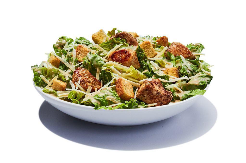 Chicken Caesar Salad · Chopped romaine, Parmesan cheese and crispy seasoned croutons with a creamy Caesar dressing. Topped with grilled or fried chicken.