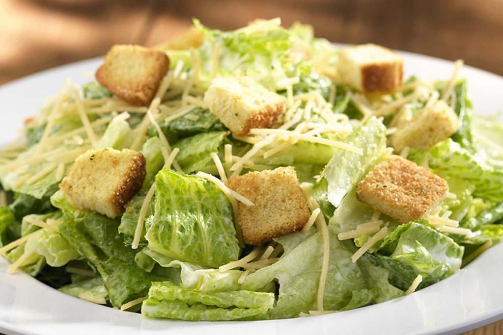 Caesar Salad · Chopped Romaine, Parmesan cheese and crispy seasoned croutons with acreamy Caesar dressing. Toppedn with grilled or fried chicken.